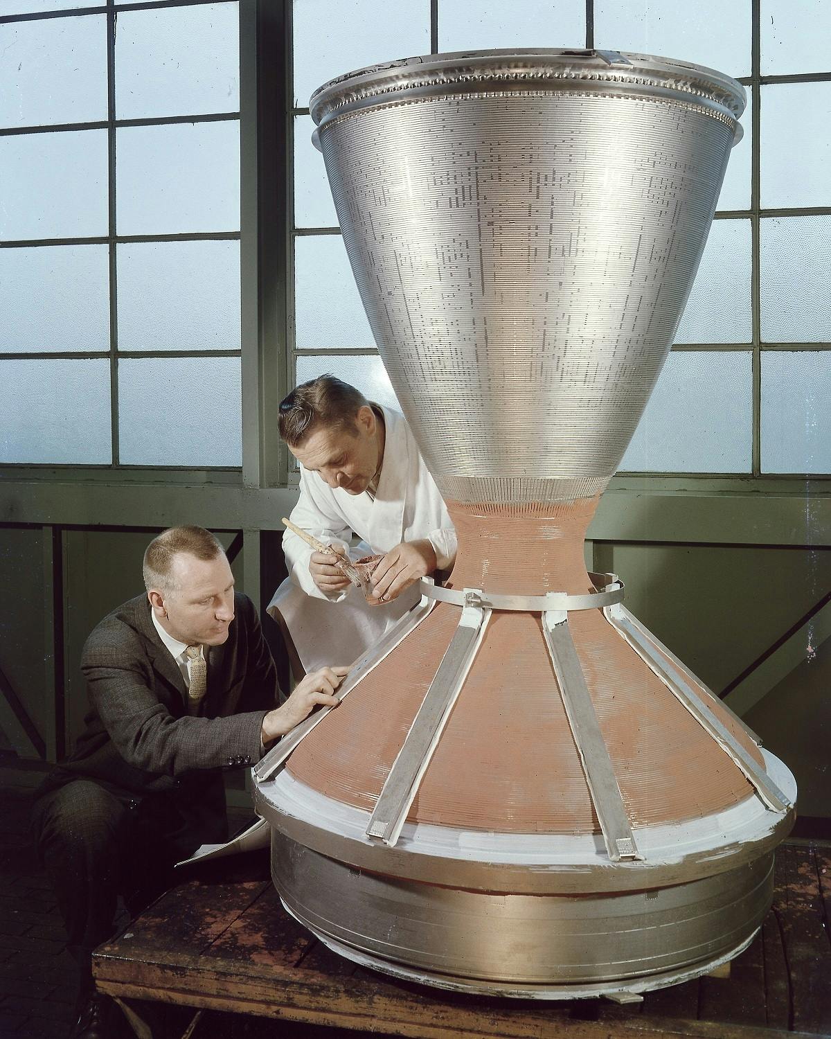 Scientist and business man inspecting a device for nuclear thermal rocketry